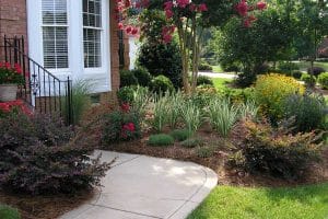 Discover the perfect curb side home entrance and pathway design created by Top Gardens Inc.